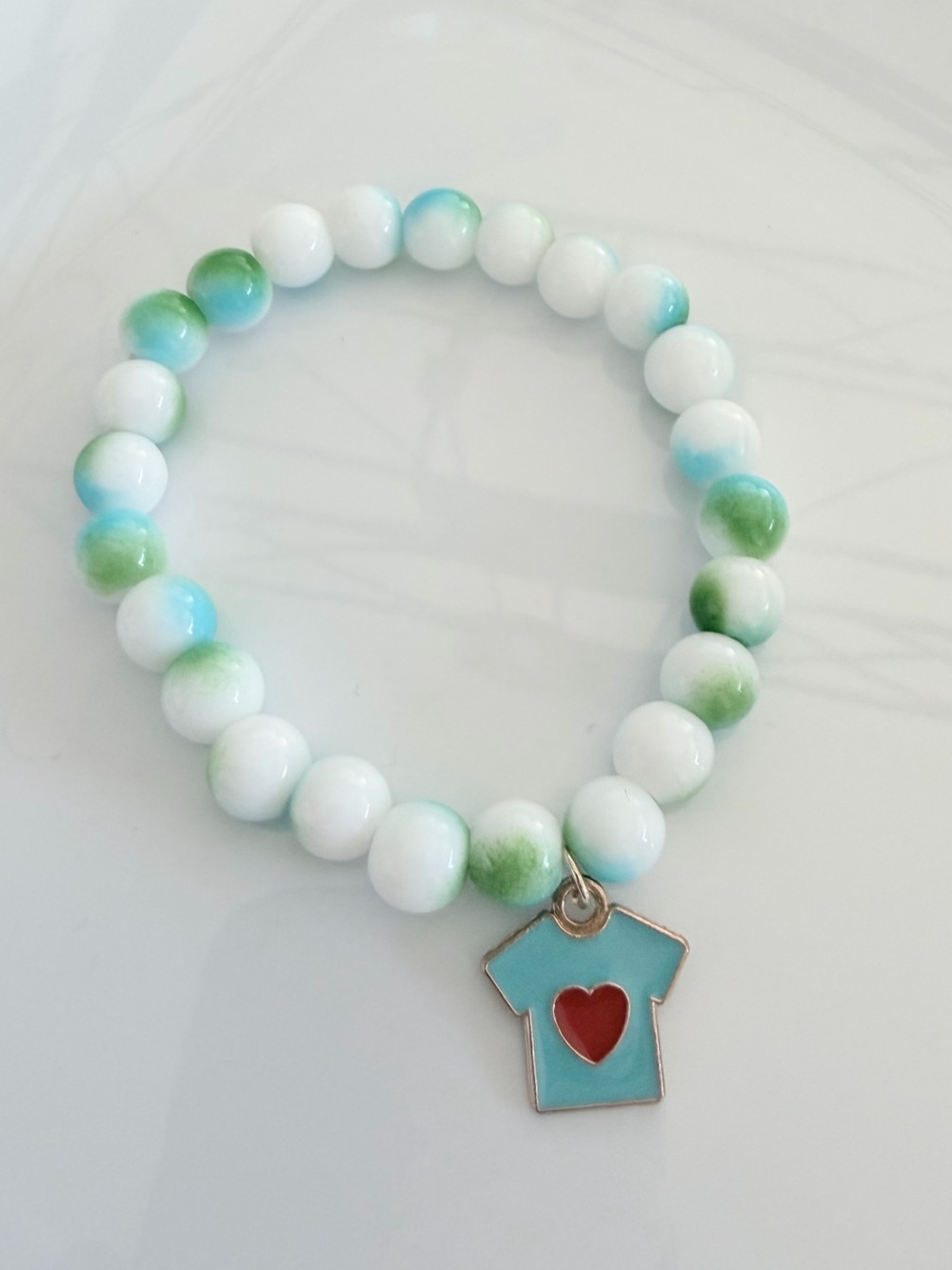 White & Aqua Beaded Bracelet with Red Heart T‑Shirt Charm